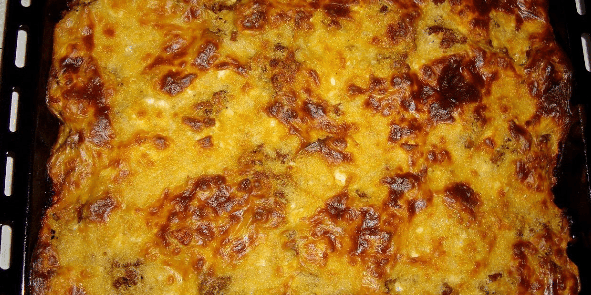 Janine Winkler Lowy's authentic high holiday moussaka, a golden-baked casserole with layers of tender eggplant, savory ground meat, and creamy béchamel, served during Rosh Hashanah and Yom Kippur to celebrate Jewish heritage and create new traditions.