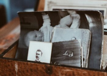 A box full of old photographs and other memorabilia.