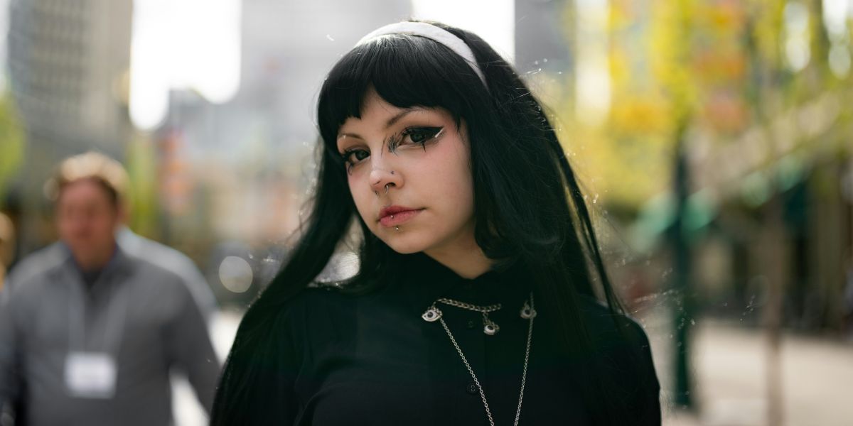 Woman in medieval-inspired gothic outfit.