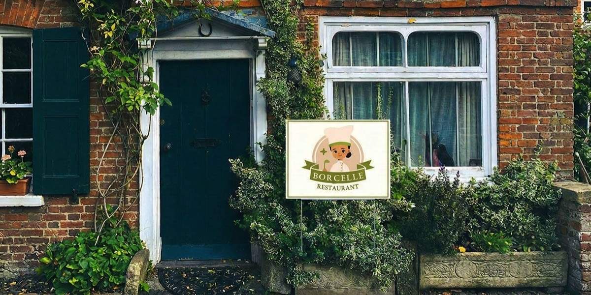 Borcelle Restaurant sign in front of a rustic brick cottage