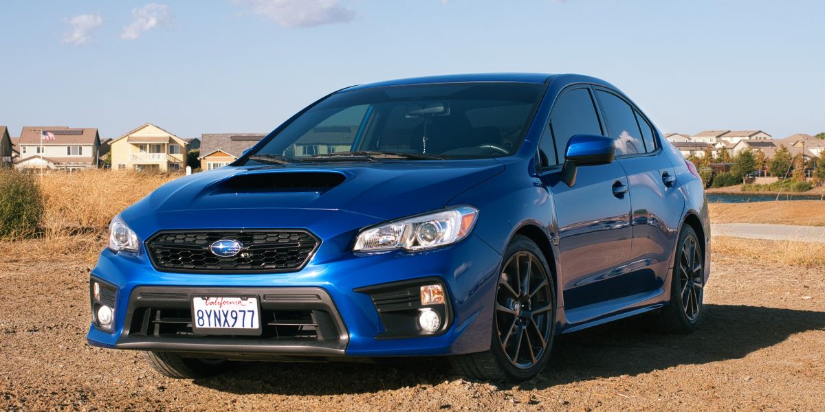 Vehicle speeding through dusty mountain road.