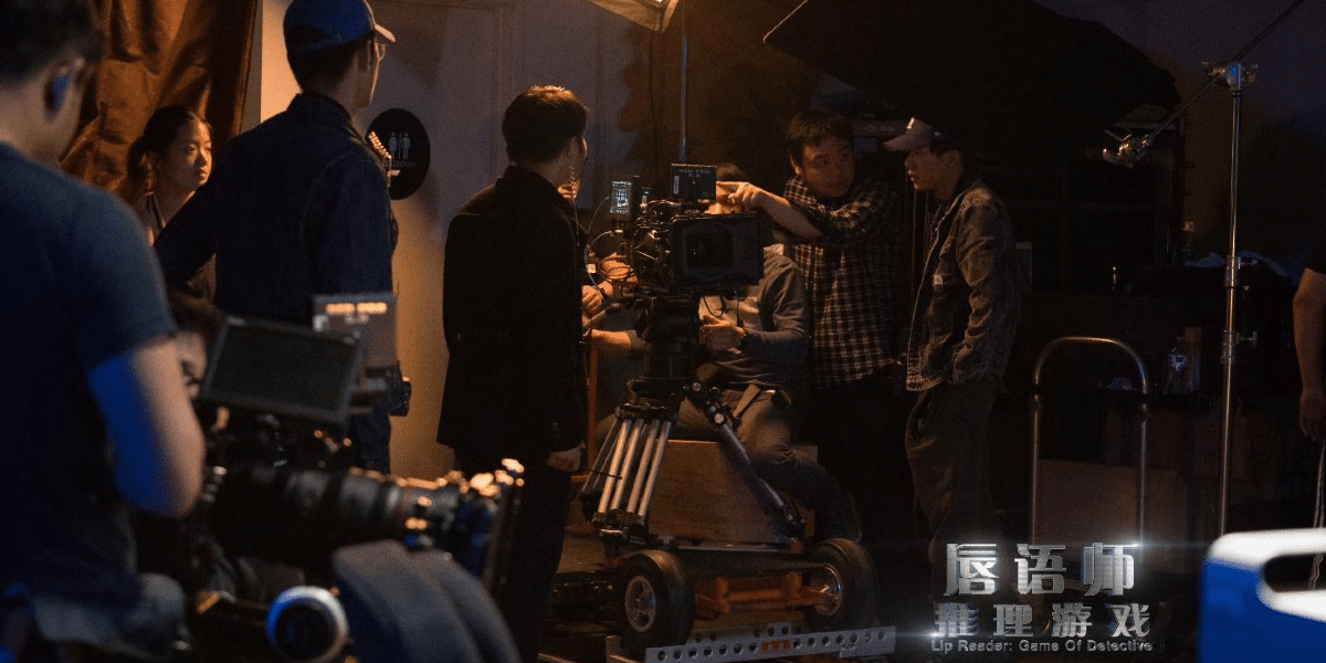 Tanxuan Shi on set with crew members